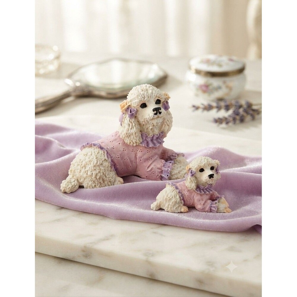 Two Vintage White Poodles Laying Down With Pink & Purple Sweater Figurines